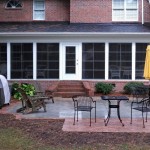 Sun room porch with wing steps overlooking patio with brick pavers